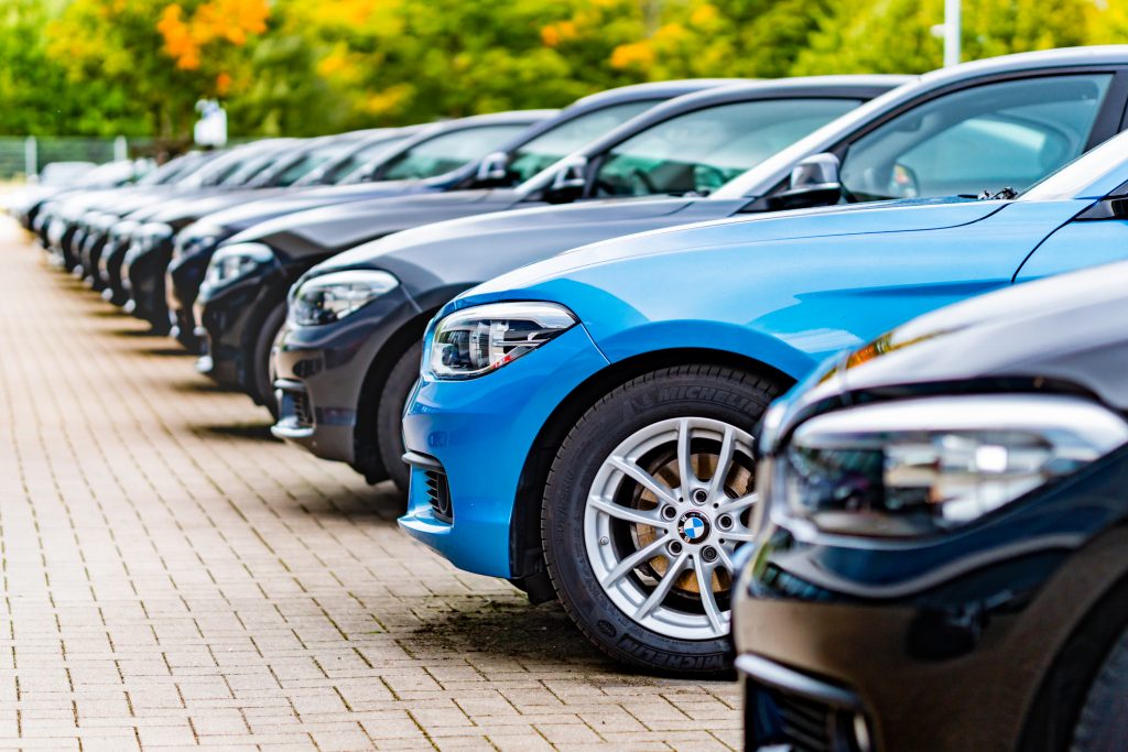 A row of used fleet BMW cars